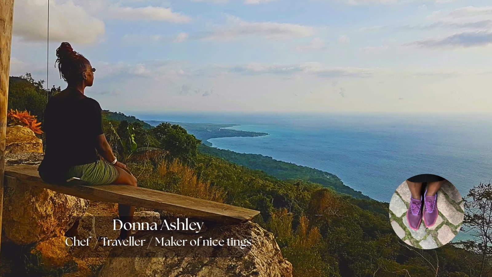 Chef Donna Ashley sitting on a stone ledge overlooking the Jamaican coastline, with ‘Chef · Traveller · Maker of nice tings’ text overlayed.